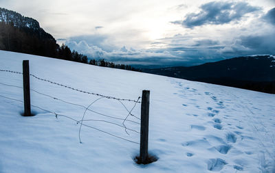 Scenic view of snow covered mountain against sky