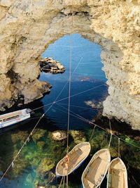 High angle view of sailboats moored on sea shore