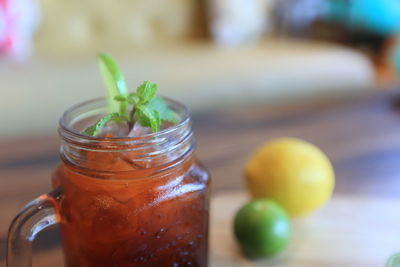 Close-up of drink in glass jar on table