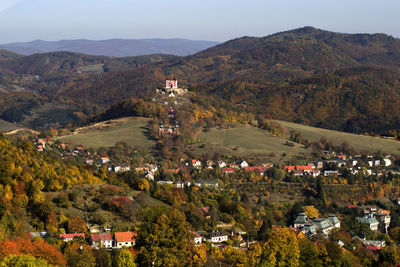 High angle view of townscape and mountains against sky