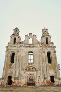 Low angle view of old building against clear sky