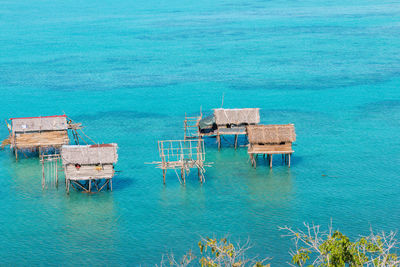 Lifeguard hut in sea against buildings