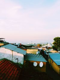 High angle view of houses and buildings against sky