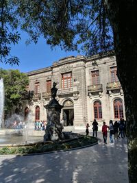 Group of people in front of building
