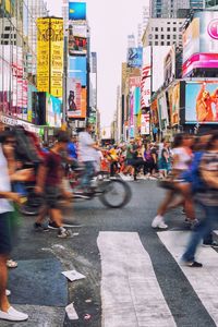 Group of people walking on city street