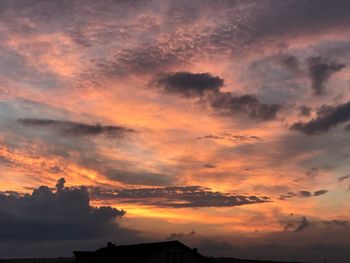 Low angle view of dramatic sky during sunset