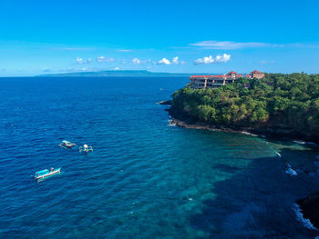 High angle view of sea against blue sky