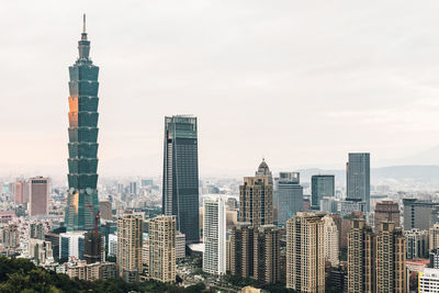 Modern buildings in city against sky