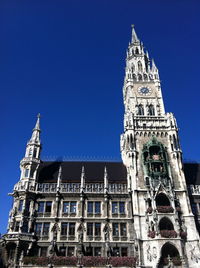 Low angle view of historical building against blue sky