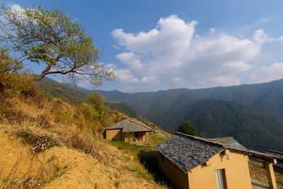 Houses and buildings against sky