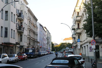 City street and buildings against sky