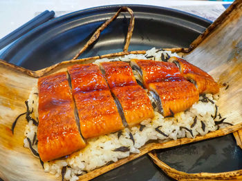 High angle view of fish on barbecue grill