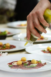 Midsection of man preparing food