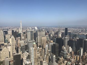 High angle view of modern buildings in city against sky