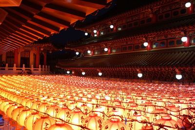 Low angle view of illuminated lights in building