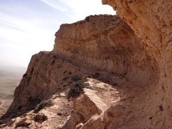 Rock formations on mountain against sky