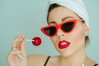 Close-up portrait of woman wearing sunglasses