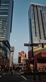 View of city street and buildings against sky