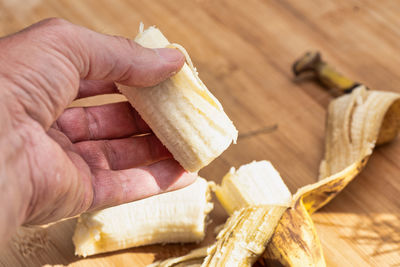 Close-up of hand holding wood