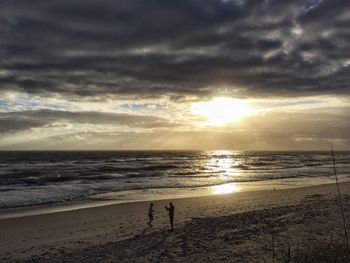 Scenic view of sea at sunset