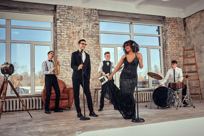 Rear view of people walking on street