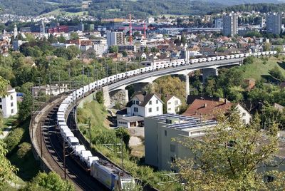 High angle view of bridge over river and buildings in city