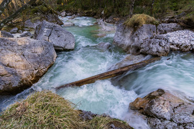 Scenic view of river flowing through rocks