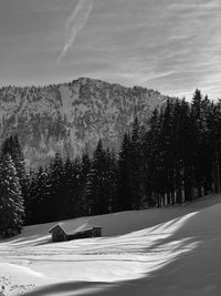 Scenic view of snow covered mountains against sky