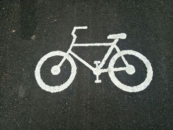 High angle view of bicycle sign on street