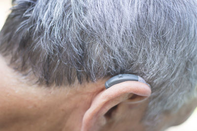 Close-up of man wearing hearing aid