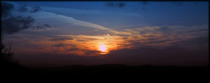 Scenic view of sunset over landscape