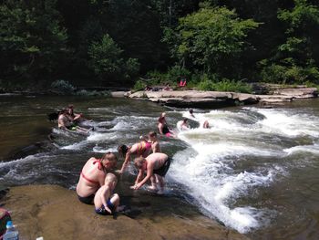 High angle view of people swimming in river