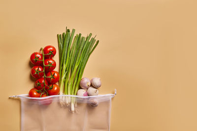 Horizontal image of a plastic free cotton reusable vegetable bag with large copy space