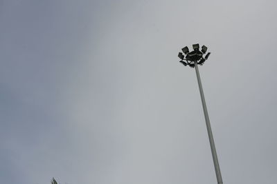 Low angle view of street light against sky