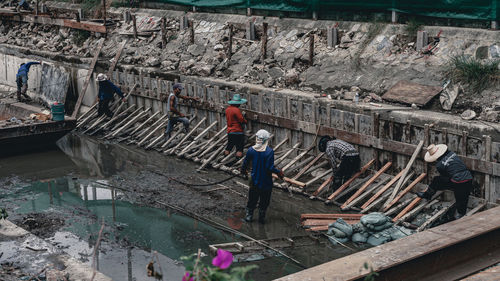 High angle view of people working in water