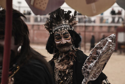 Portrait of mask on display outdoors