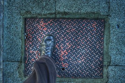 Low section of man standing on floor