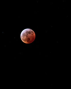 Low angle view of moon against sky at night