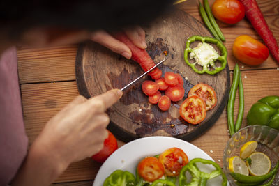 High angle view of man preparing food on table