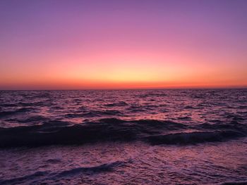 Scenic view of sea against clear sky during sunset