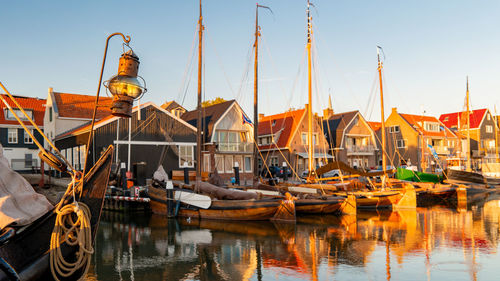 Boats moored at harbor