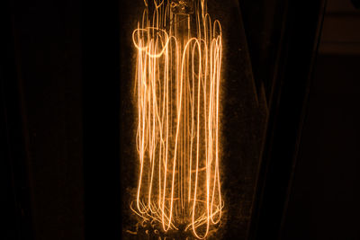 Close-up of illuminated lights at night