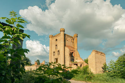 Low angle view of old building against sky