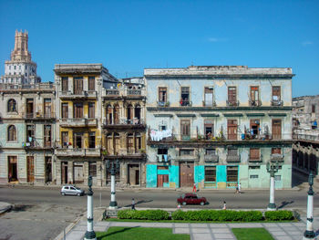 Buildings against clear blue sky