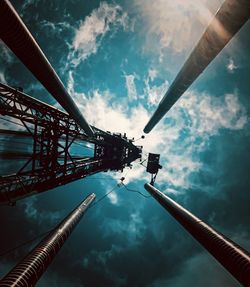 Low angle view of crane tower against sky