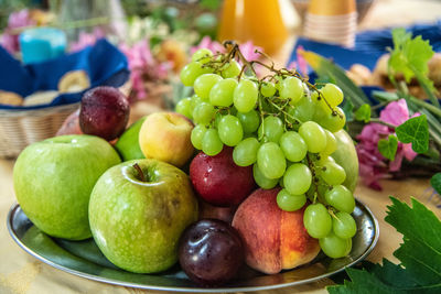 Close-up of grapes in plate on table