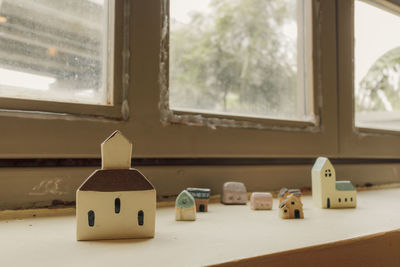 Close-up of toy on window sill at home