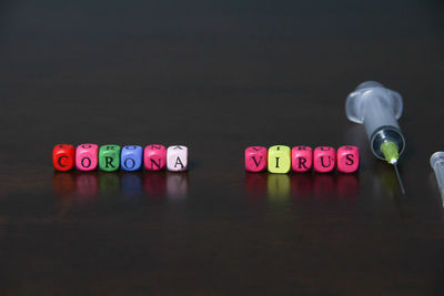 Close-up of text on table against black background