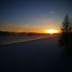 Scenic view of silhouette landscape against sky during sunset