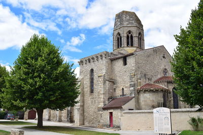 Low angle view of bell tower against sky